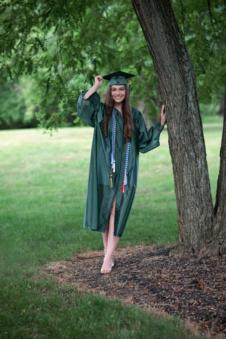 EBHS senior girl standing by a tree